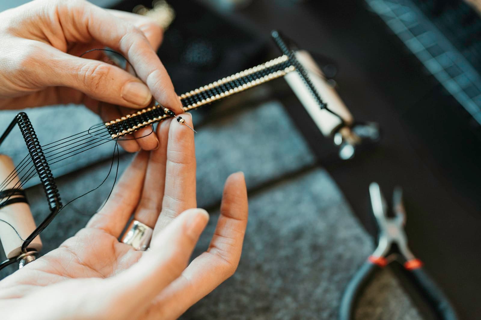 A person working on a piece of jewelry