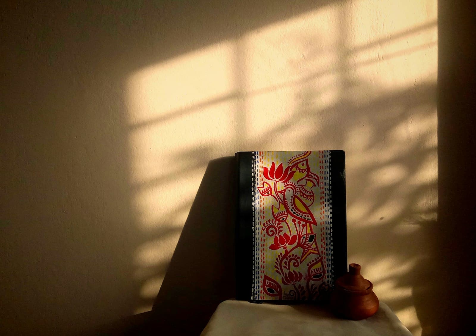 A decorated book illuminated by sunlight