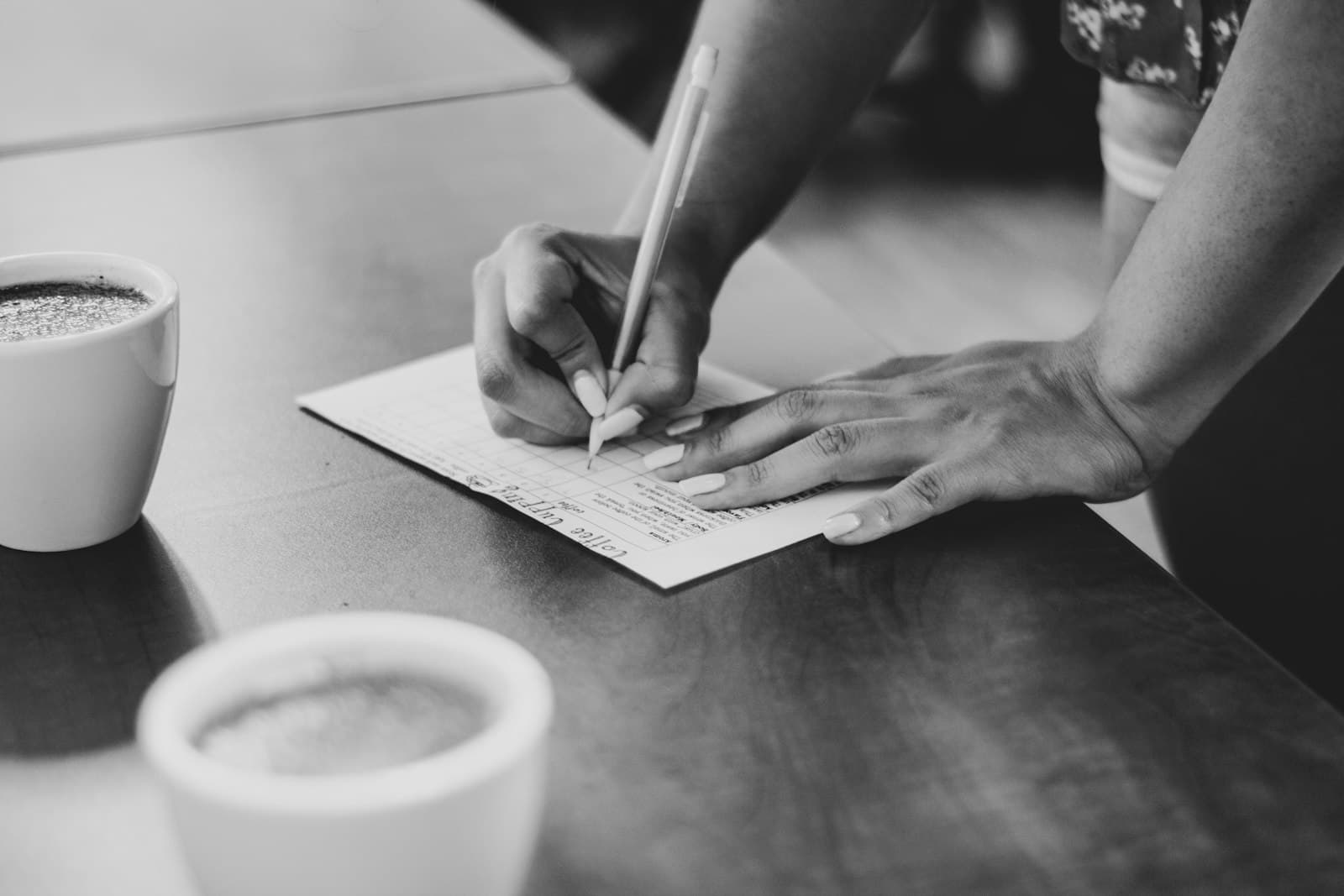 A person writing on paper